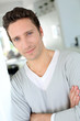 Photo: Portrait of handsome single man at home Portrait of handsome single man at home