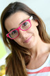 Photo: Funny girl with pink eyeglasses Funny girl with pink eyeglasses