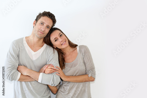 Photo: Young couple standing on white background Young couple standing on white background
