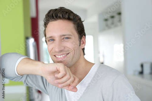 Photo: Portrait of handsome single man at home Portrait of handsome single man at home