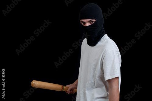 Photo: Masked man preparing to attack with bat Masked man preparing to attack with bat
