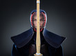 Kendoka keeps the shinai in front of the face