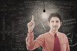 Asian businessman has idea in class