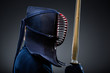 Profile of kendoka with shinai