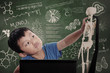 Little boy learns human anatomy