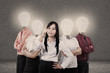 Businesswoman and team with light bulb heads