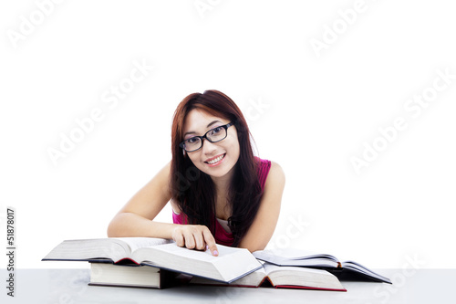 Photo: Happy student learning isolated on white Happy student learning isolated on white