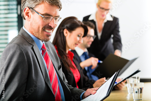 Photo: Business - businesspeople have team meeting Business - businesspeople have team meeting