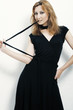 A beautiful woman in a black dress  on the  white background