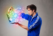 Casual man holding laptop with colorful hand drawn multimedia sy