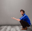 Young man presenting an empty copy space