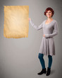 Young girl presenting old paper copy space