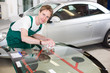 Glazier with car windshield made of glass