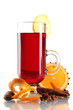 mulled wine in the glass, spice and orange isolated on white