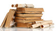 Pile of old books and scroll isolated on white