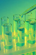 test-tubes with liquid on blue background
