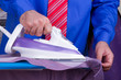 Businessman Ironing Clothes