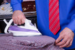 Businessman Ironing Clothes