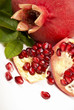 Fresh, juicy pomegranate on a white background