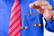 Businessman Shows Scales
