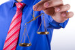 Businessman Shows Scales