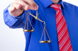 Businessman Shows Scales