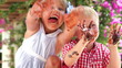 Children Waving Chocolate Covered Hands At Camera