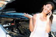 Woman with broken car
