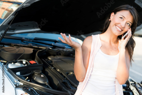 Photo: Woman with broken car Woman with broken car