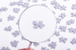 Photo: Magnifying Glass and Single Puzzle Piece Magnifying Glass and Single Puzzle Piece
