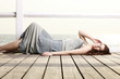 young woman is relaxing on the pier