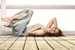 young woman is relaxing on the pier