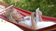 Video: Senior Woman In Hammock Using Tablet Computer Senior Woman In Hammock Using Tablet Computer