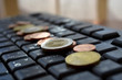 Photo: Coins on the keyboard Coins on the keyboard