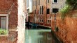 Channel in Venice embedded in old houses