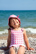 Photo: happy little girl at the seaside in the summer happy little girl at the seaside in the summer