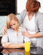 Mother soothes sad daughter