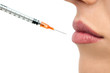 Botox syringe and lips.