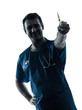 doctor man holding hypodermic syringe silhouette portrait