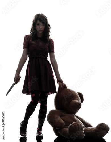 Photo: strange young woman killer holding bloody knife silhouette strange young woman killer holding bloody knife silhouette