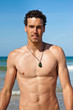 Handsome fit young man on the beach