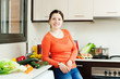 woman with  vegetables in home kitchen