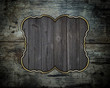 Wooden grunge texture with a nameplate of wood with gold trim