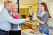 Senior couple buying glasses