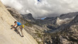 Climber scales a cliff.