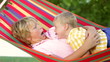 Video: Two Boys Relaxing In Garden Hammock Together Two Boys Relaxing In Garden Hammock Together