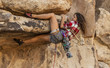 Female climber gripping the rock.