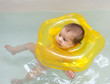 Newborn baby bathes in bath
