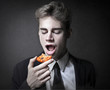 man eats cookie