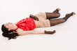 Lifeless brunette lying on the floor